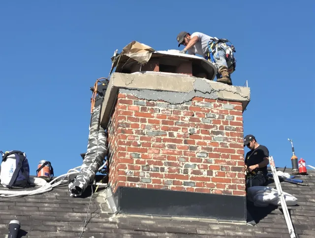 New Milford Chimney Sweep installing a custom chimney crown in New Milford, CT