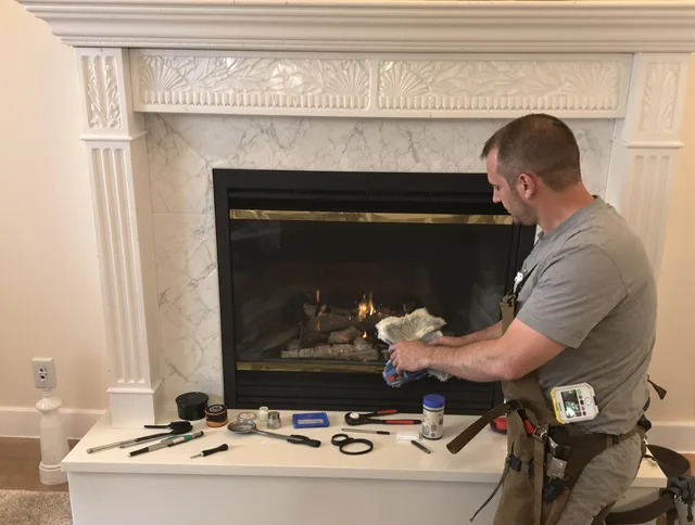 New Milford Chimney Sweep performing fireplace maintenance in New Milford, CT