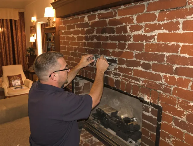 New Milford Chimney Sweep expert fixing a fireplace in New Milford, CT